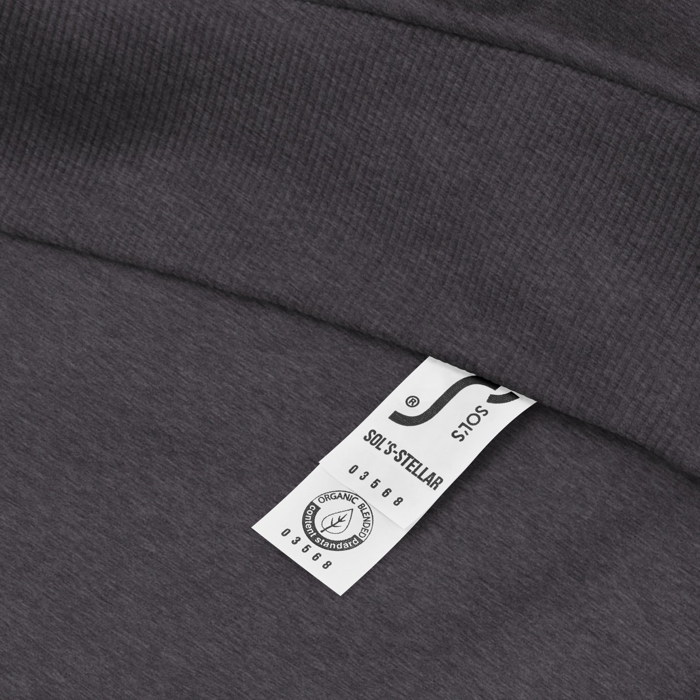 close up detail of heather grey organic cotton hoodie showing makers label.