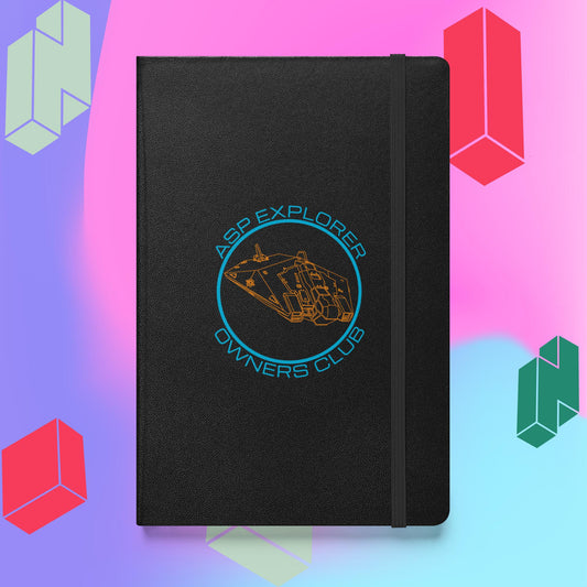 A hardcover black bound notebook with the Asp Explorer Owners Club design in orange and blue, with wireframe image of Asp explorer and text round a circle. The book has an elastic strap and is against a backdrop of purple, pink and blue with tetris style block graphics.