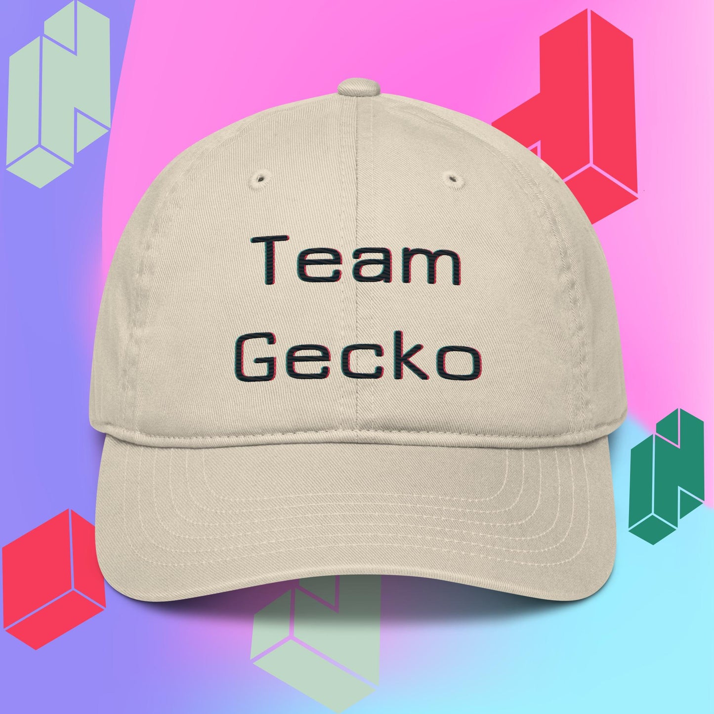 Oyster organic cotton baseball cap with curved bill. Team Gecko glitch text embroidered on the front. Backdrop is purple pink and blue gradient with tetris style block graphics.
