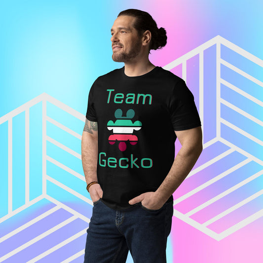 Man wearing black organic cotton t-shirt with Gecko Gamer Gear logo and "Team Gecko" glitch slogan. The backdrop is blue, pink and purple gradient with white graphics.
